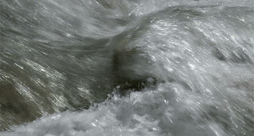 Animated gif of water flowing fast, in a loop
