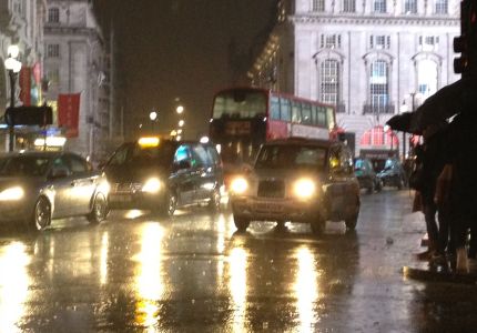 Rainy London - photo of a taxi driving thru London on a rainy night…